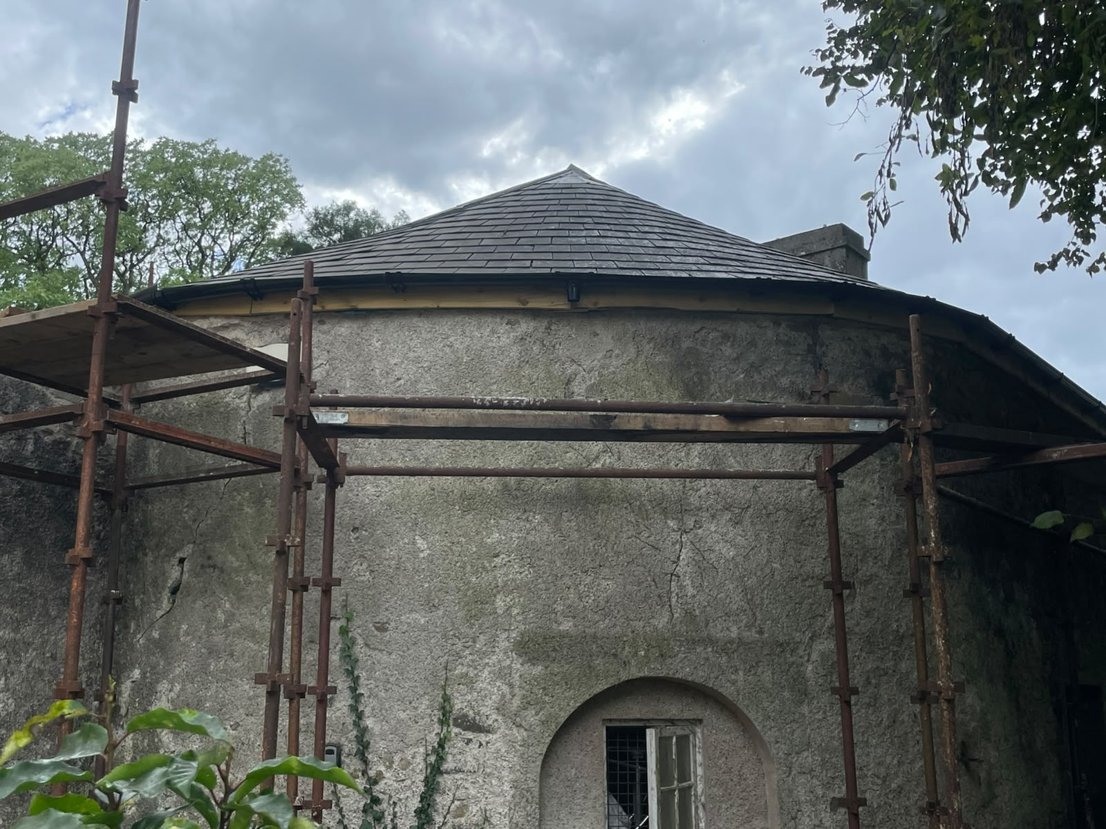 Period stone tower with new slate roof by Stonevale Construction