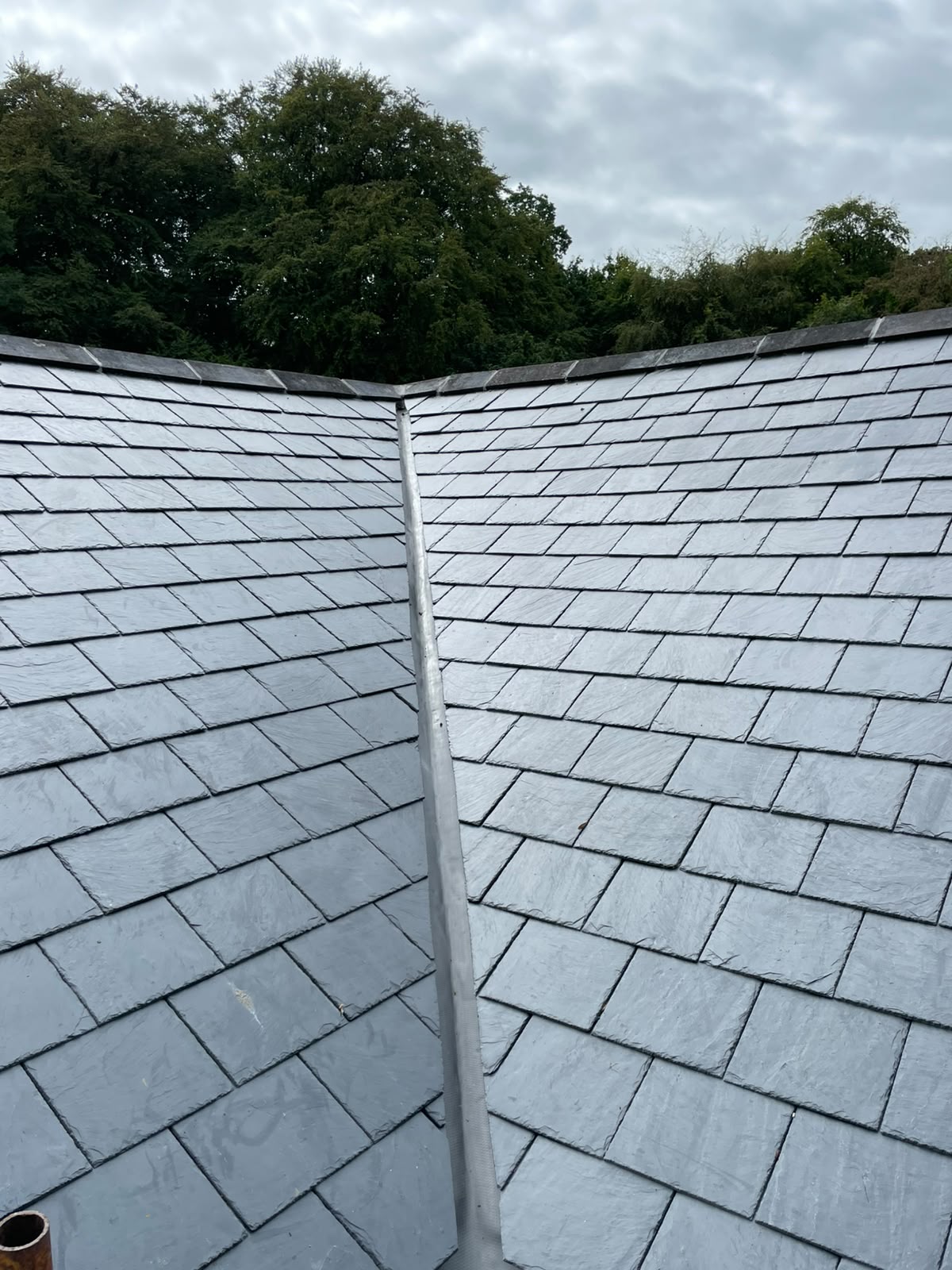 Two slate roof planes meeting at a valley, Stonevale Construction