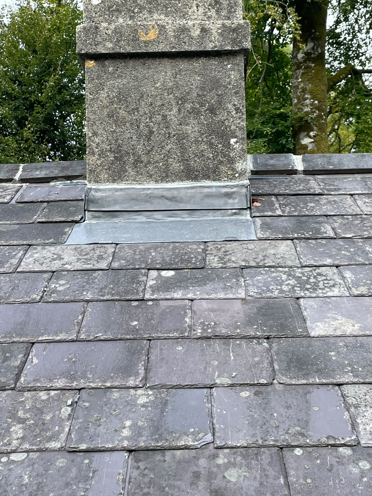 Slate roof and rendered chimney stack by Stonevale Construction