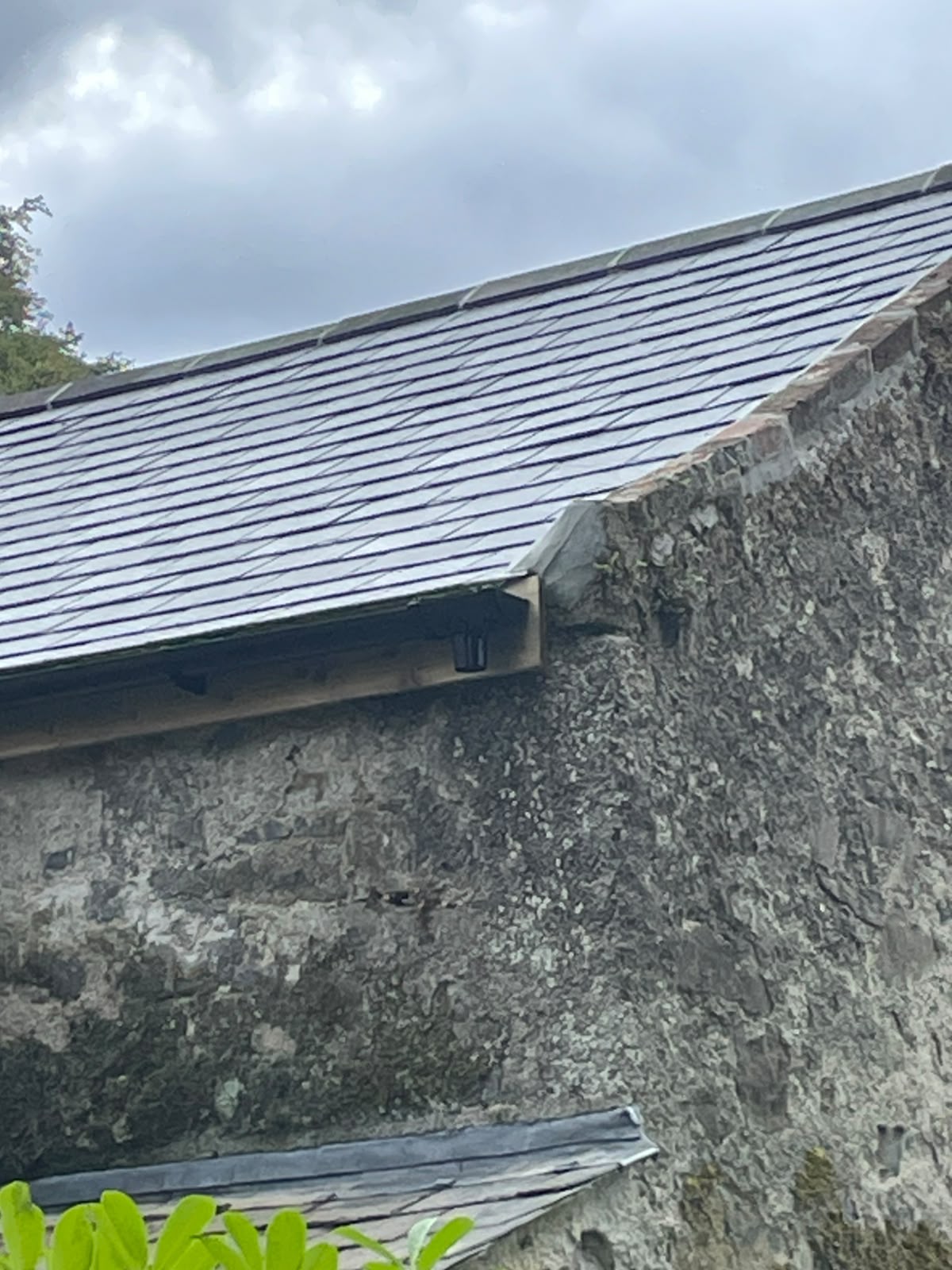 Slate roof edge and stone gable by Stonevale Construction